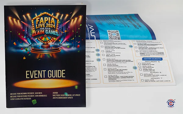 Open saddle stitch event program laying relatively flat for easy reading