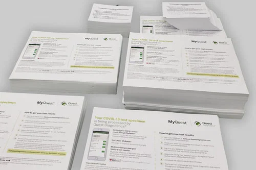 Picture that shows several piles of color copies