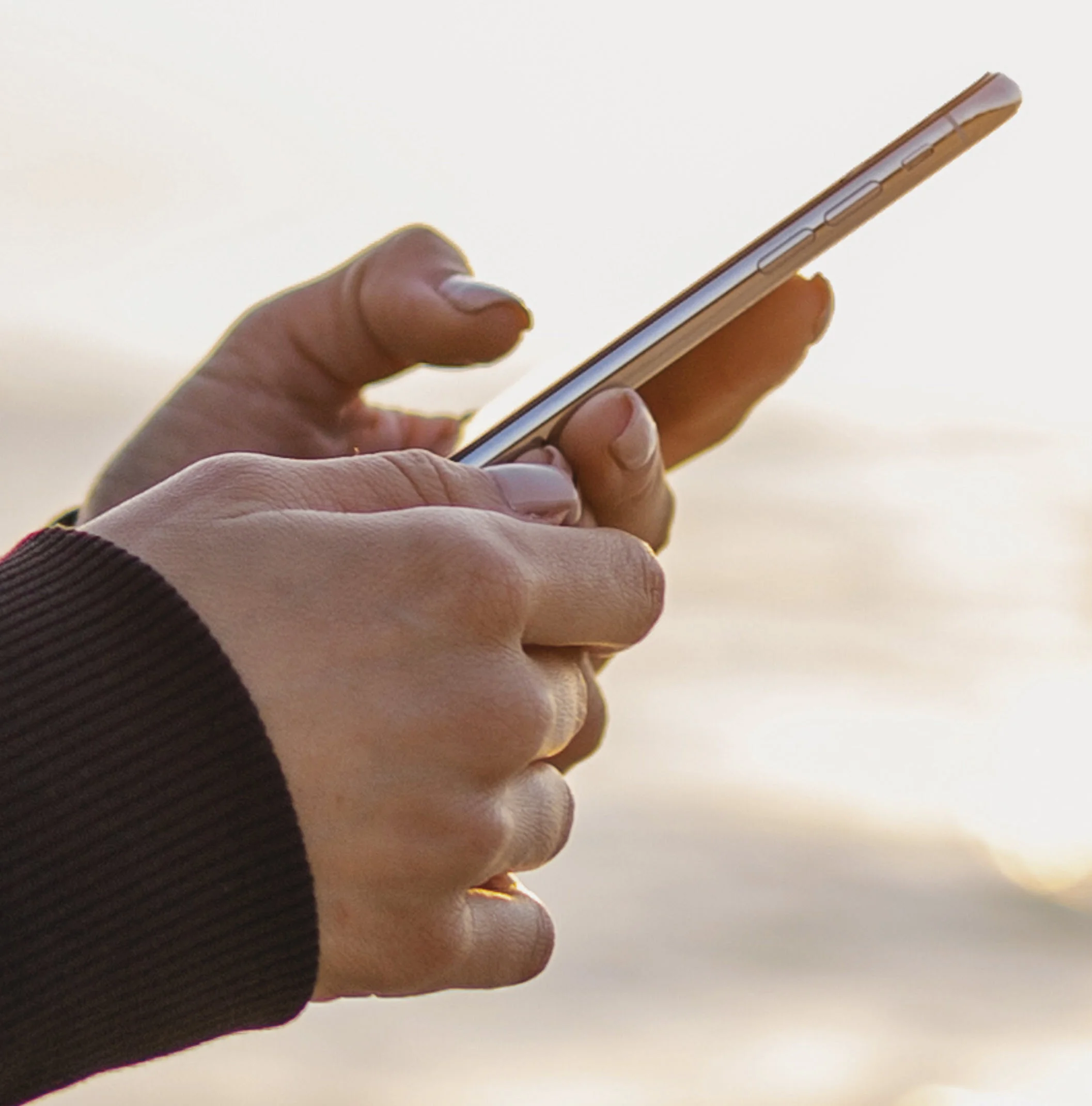 High resolution image example showing sharp clear details on a hand holding a phone