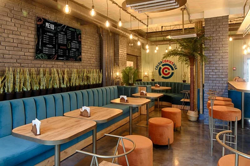 Smaller indoor vinyl banner preserving wall space and room aesthetics Smaller indoor vinyl banner in a restaurant with more open wall space